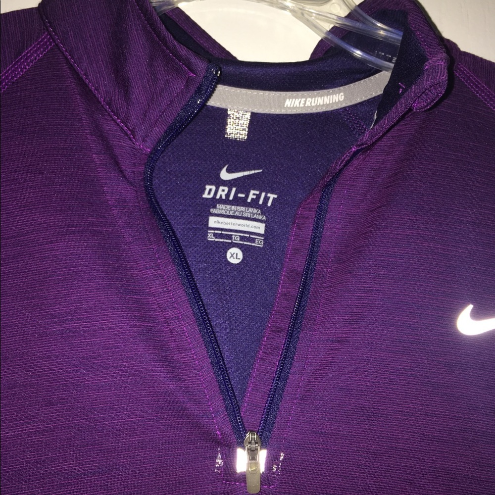 Woman’s purple dri fit Nike athletic top